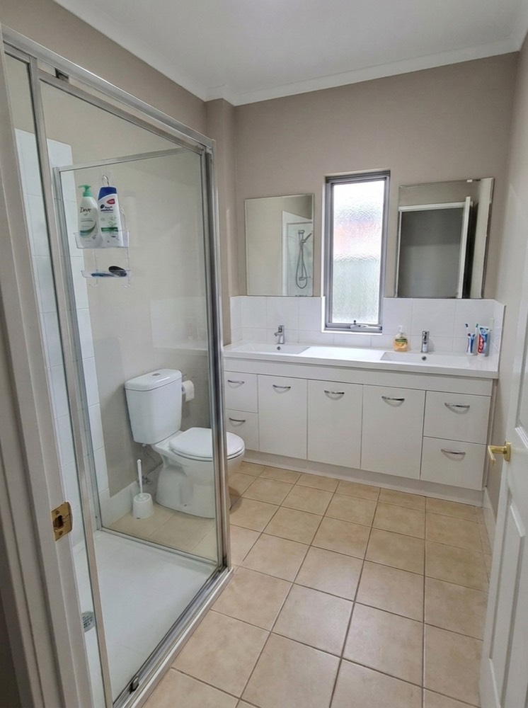 Dated beige bathroom before renovation