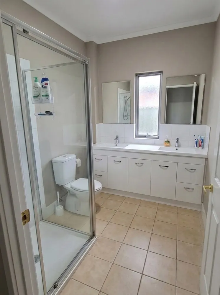 Dated beige bathroom before renovation